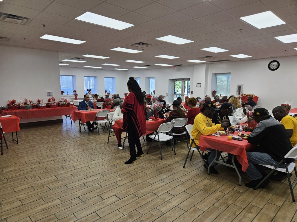 Buffalo Soldiers frying fish for Cocoa seniors holiday breakfast